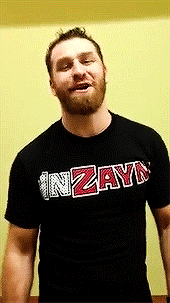 a man with a beard wears a black shirt that says inzayn