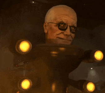 a man wearing glasses is standing in a dark room with yellow lights behind him