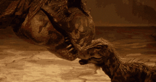 a close up of a dinosaur 's mouth and feet