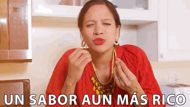 a woman in a red shirt says un sabor aun mas rico in a kitchen