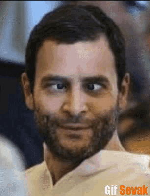a close up of a man 's face with a gif sevak watermark