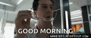 a man is holding a pair of glasses in front of his face and says `` good morning '' .