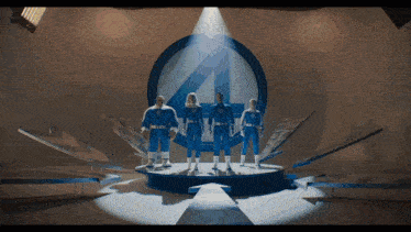 a group of fantastic four standing on a stage in front of a fantastic four logo
