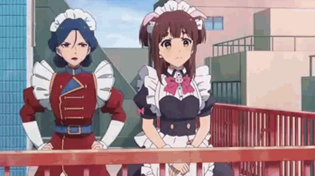 two anime girls in maid outfits are standing on a balcony .