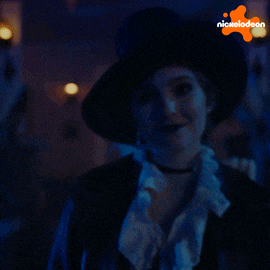 a skeleton is in a dark room with a nickelodeon logo in the background