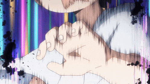 a close up of a person 's fist with a rainbow background