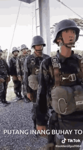 a group of soldiers are standing in a line with the caption puting inang buhay to tiktok