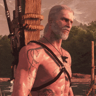 a shirtless man with tattoos on his chest including one that says ' i am a witch '