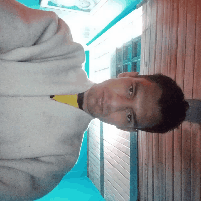a man taking a selfie with his arms crossed
