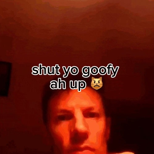 a man 's face is shown with the words shut yo goofy ah up below it