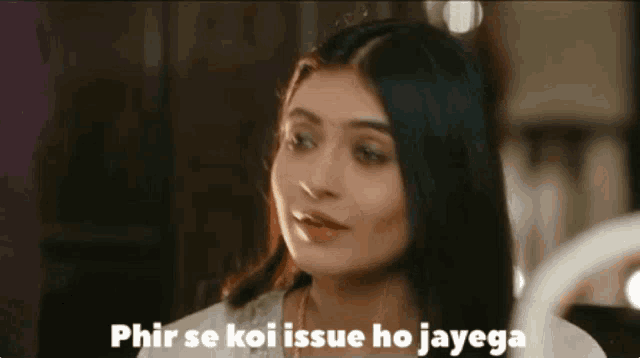 a woman is looking at herself in a mirror with the words phir se koi issue ho jayega below her