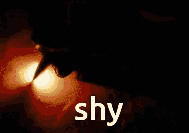 a close up of a person 's mouth with the word shy in white