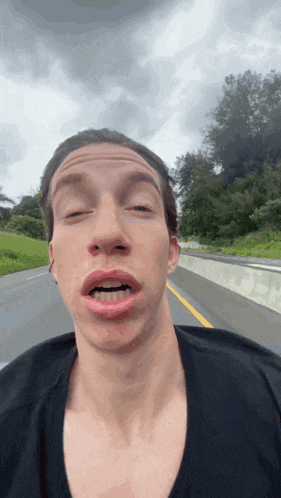a man making a funny face with his mouth open