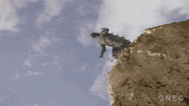 a picture of a dragon flying over a cliff with the word oneg in the corner
