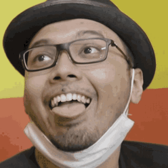a man with glasses and a mask on his face