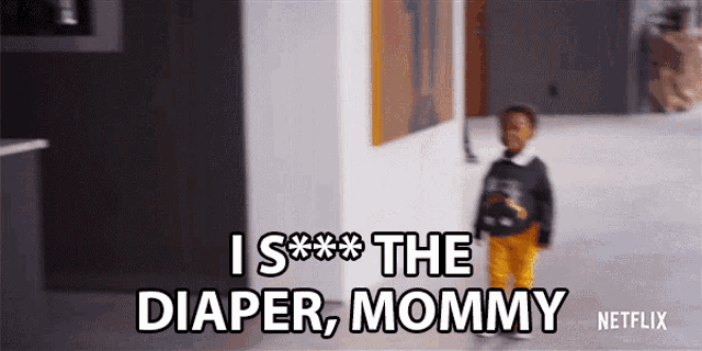 a baby is standing in front of a wall that says i s *** the diaper mommy netflix