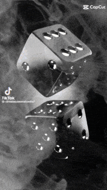 a black and white photo of a pair of dice that says tik tok