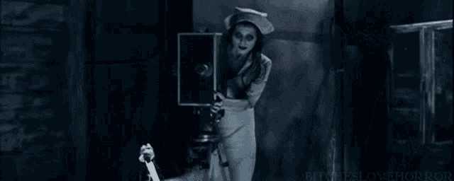 a nurse with glowing eyes looks at a computer screen
