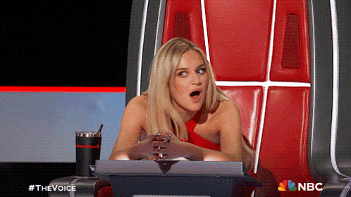 a woman sitting in a chair with a nbc logo on the bottom right