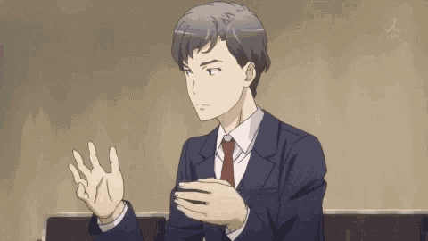 a man in a suit and tie is making a funny face