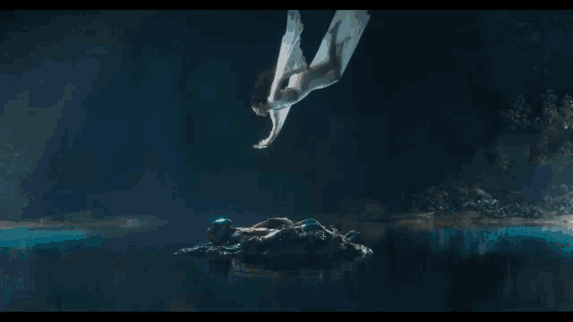 a woman in a white dress is flying through the air