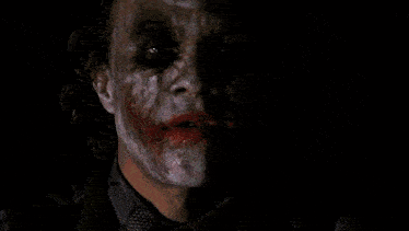 a close up of the face of a joker