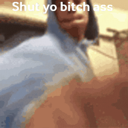 a blurred image of a person with the words shut yo bitch ass written on it