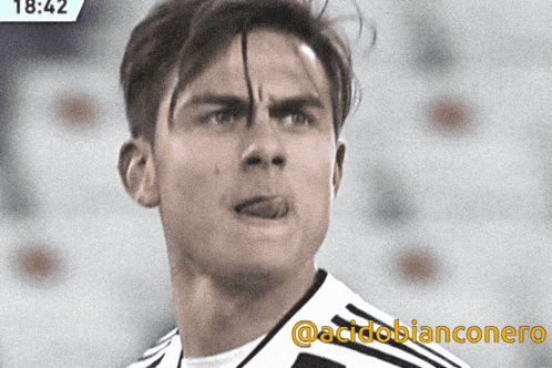 a close up of a soccer player 's face with the words @acidobianconero on the bottom