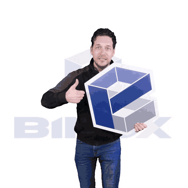 a man in a black jacket is holding a sign with the letter b on it