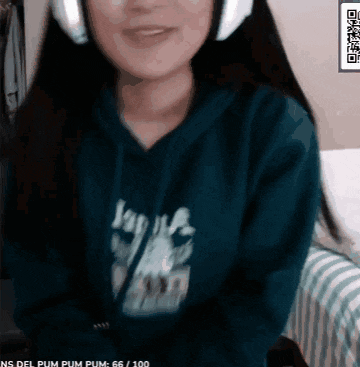 a woman wearing headphones and a blue hoodie has a qr code on her shirt