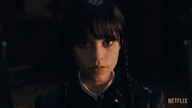 a girl with pigtails is looking at the camera with the words impressive above her
