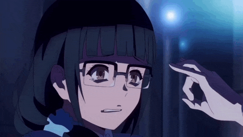 a girl wearing glasses and a black hat holds her hand to her head