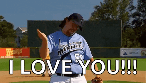 a man in a baseball uniform is standing on a baseball field .