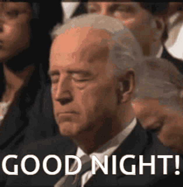a man in a suit and tie with his eyes closed says good night .