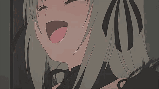 a close up of a girl 's face with her tongue out