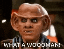 a close up of a man with a mask on his face and the words `` what a wooman ! ''