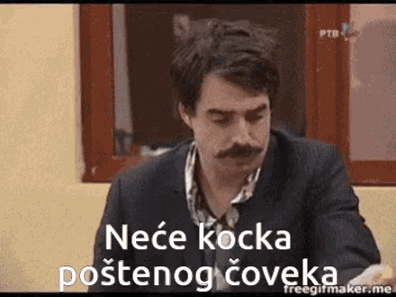 a man with a mustache is sitting in front of a window with the words " nece kocka postenog coveka " on the screen