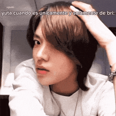 a close up of a person 's face with a caption that says yuta cuando es únicamente y solamente de bril