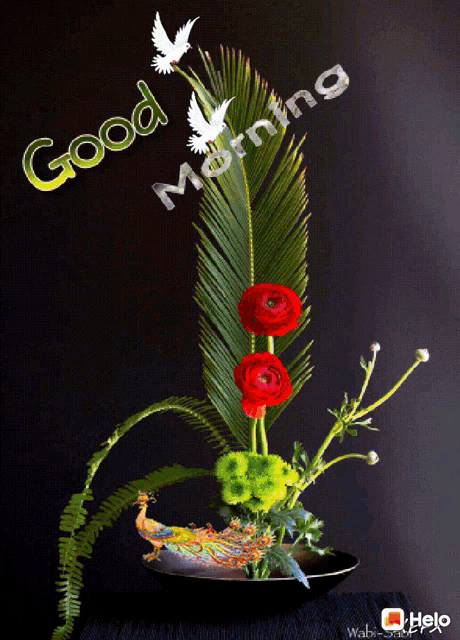 a bouquet of flowers in a vase with the words good morning written above it