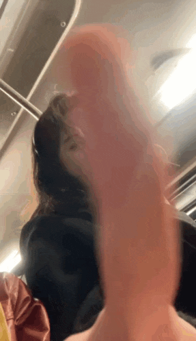 a close up of a person 's face on a bus