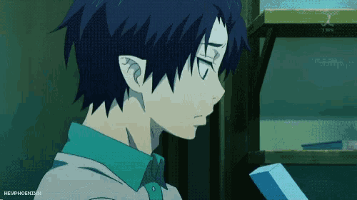 a blue haired anime character with a blue shirt and a blue box in front of him
