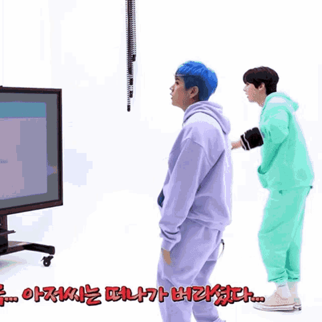 a man with blue hair is standing next to another man in green