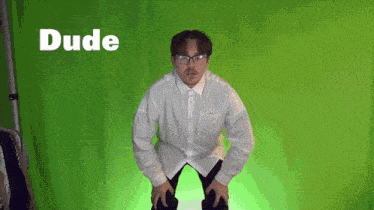 a man wearing glasses and a white shirt is standing in front of a green screen and the word dude is above him