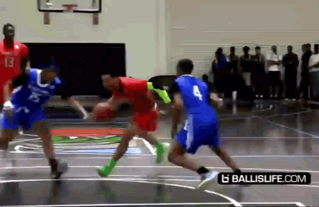 a basketball game is being played on a court with a ballislife.com logo