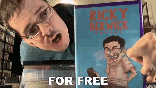 a man is holding a ricky berwick comic book