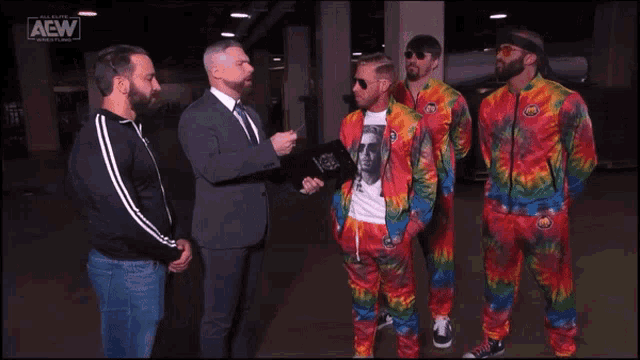 a group of men standing next to each other with aaw written on the bottom
