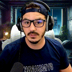 a man wearing glasses and headphones is wearing a shirt that says hawks