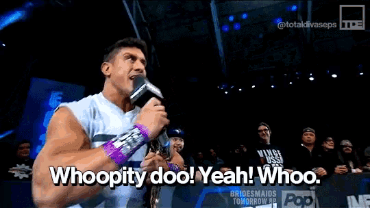a man is holding a microphone and saying whoopity doo