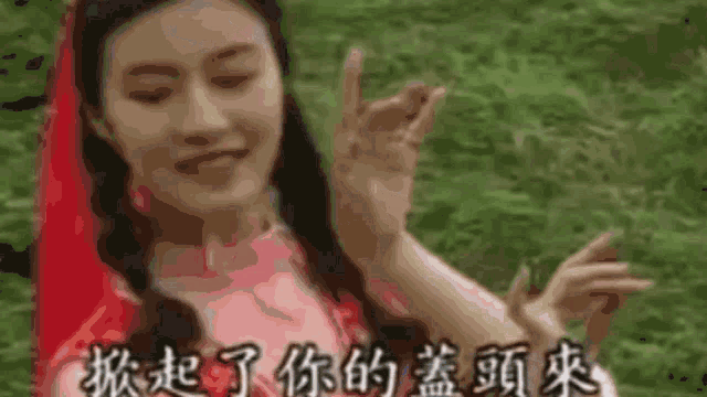 a close up of a person 's face with chinese writing behind it