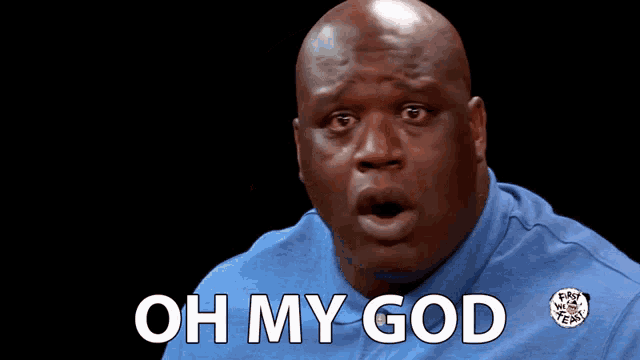 a bald man wearing a blue shirt with the words oh my god on it